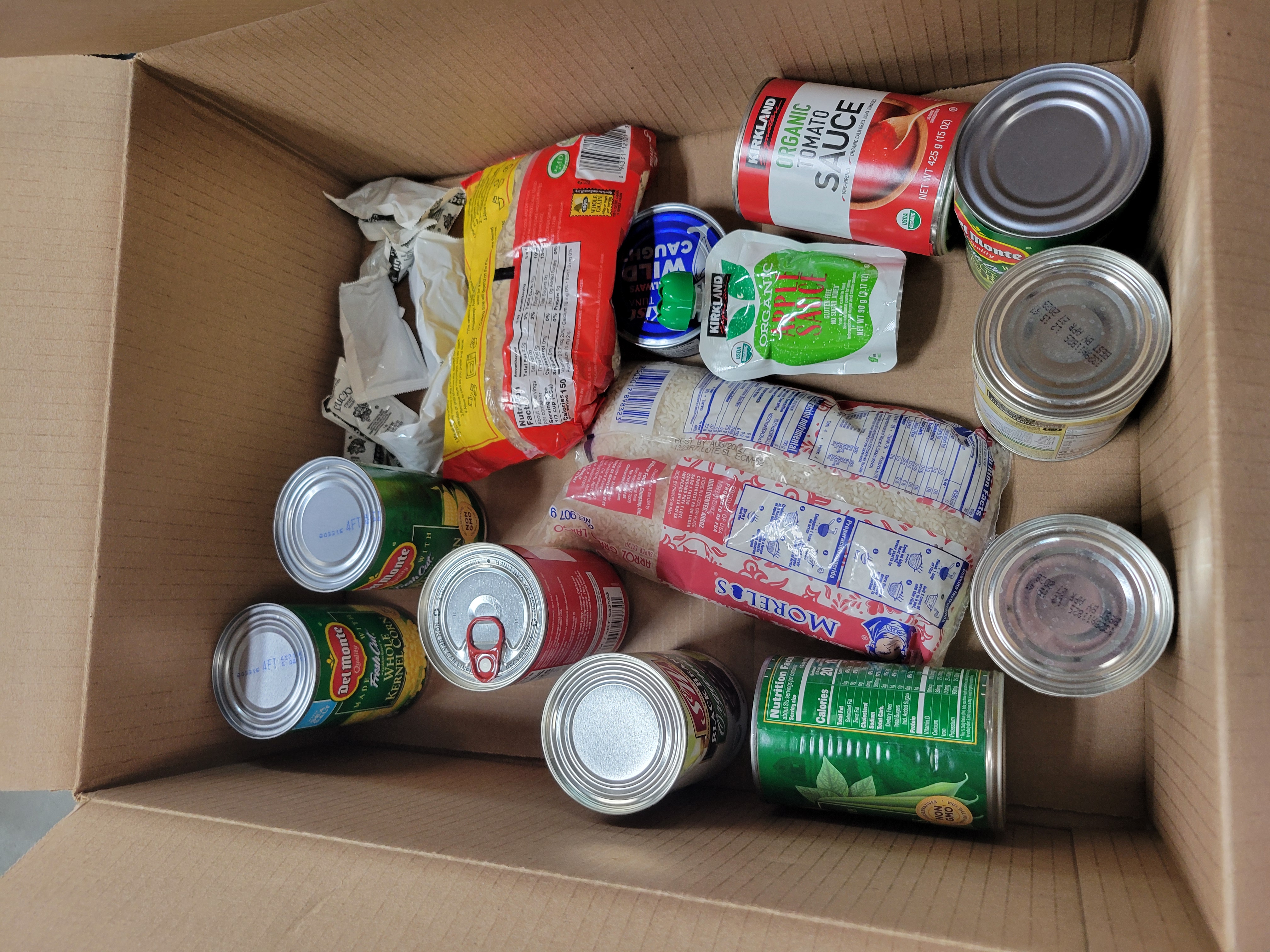 Cardboard box full of dry goods.